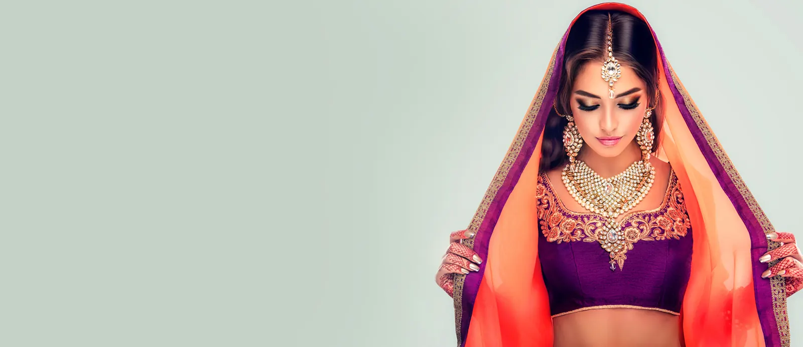 A bride wearing traditional gold bridal jewellery